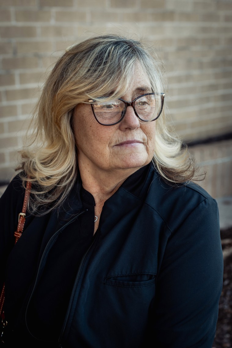 Debbie Dyer sits outside