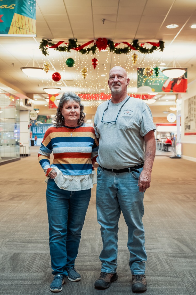 Richard, right, and Janet Houston stand next to each other in a mall