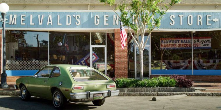 The exterior of Melvald's General Store, with a green car parked out front