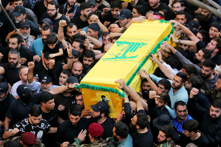 Hezbollah held the funeral on November 24 for its top military chief and other members of the militant group a day after Israel killed them in a strike on Beirut's southern suburbs. (