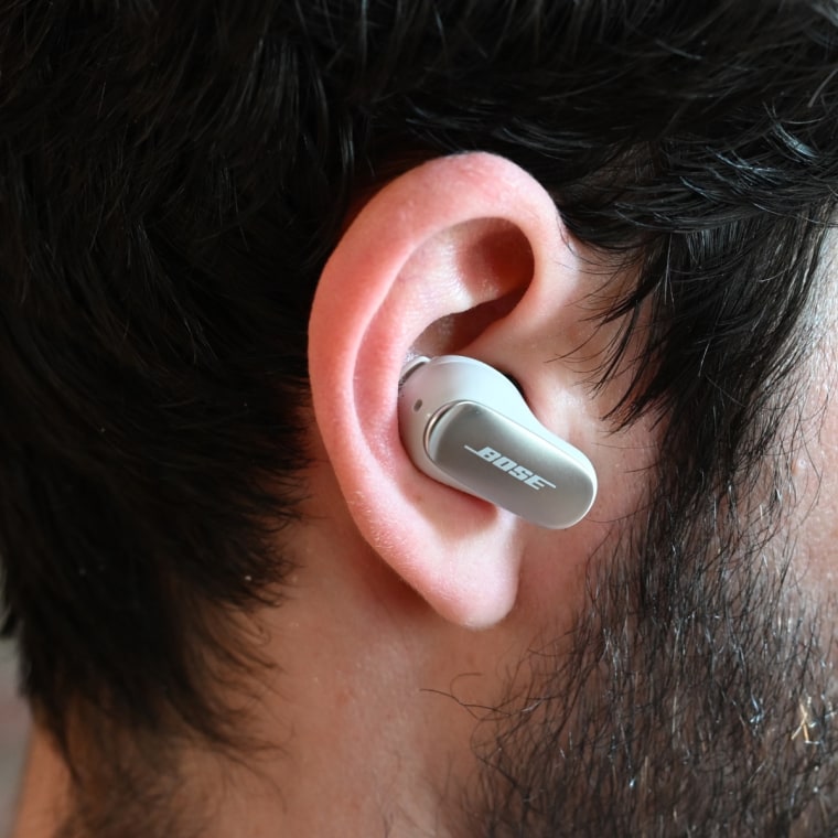 A close up of a Bose Quiet Comfort Ultra earbud in the ear of the writer.