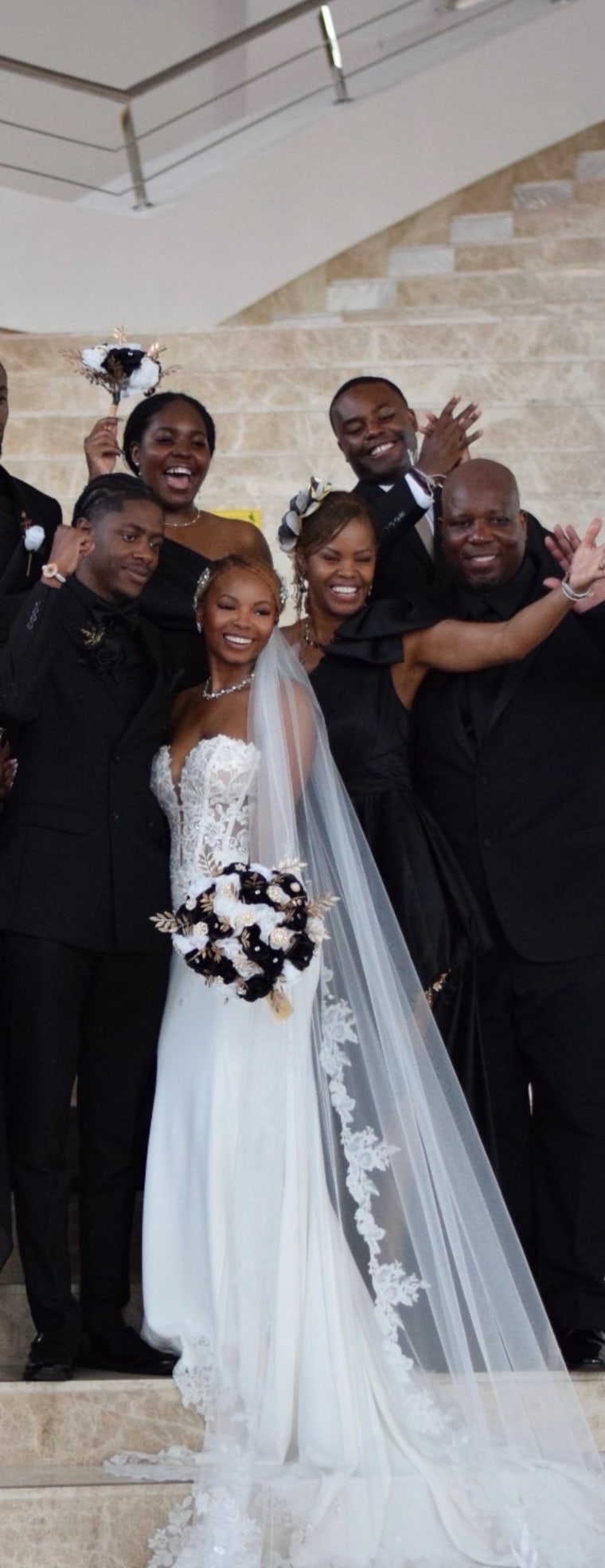 Kaira Quiller on her wedding day with her sister, Stephanie, behind her.