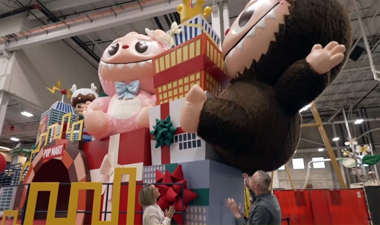 Dylan Dreyer (bottom left) gets an upclose look at the Labubu float, alongside Brendan Kennedy, Macy's director of creative production.