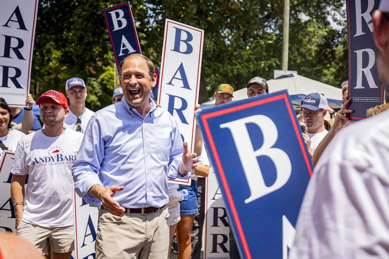 Andy Barr, center, smiles at his supporters.