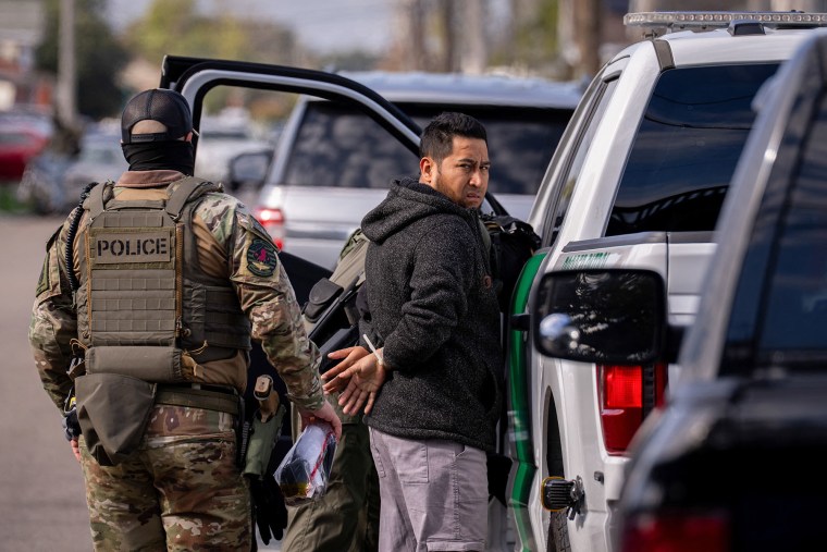 A person is detained by U.S. Customs and Border Patrol in New Orleans on Dec. 3, 2025.