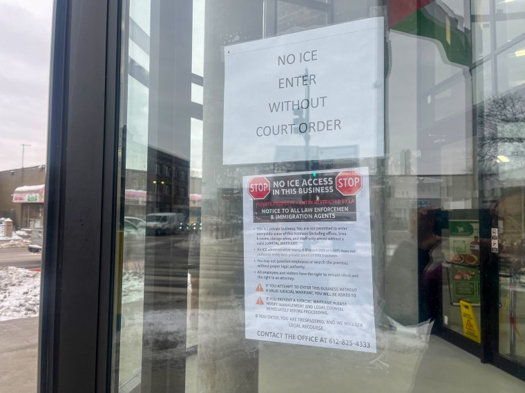 A sign posted at one of the businesses in Karmel Mall, a major center of Somali commerce in Minneapolis, declares, “No ICE entry without a court order.”