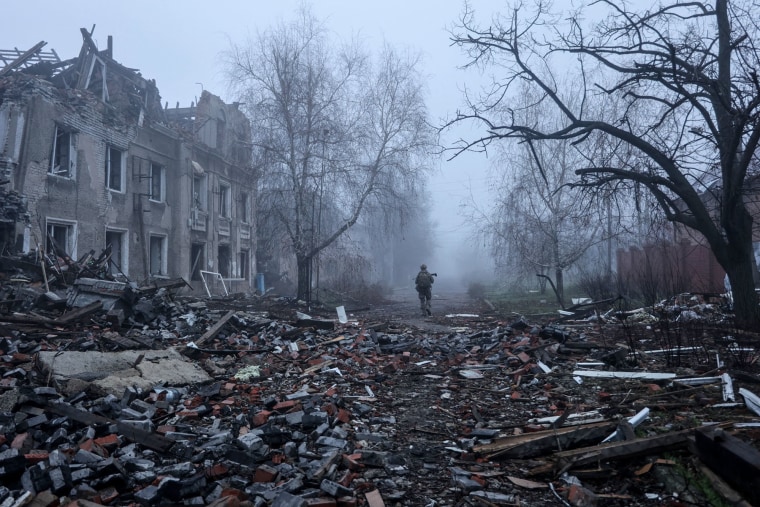 A Ukrainian soldier walks past destroyed buildings in the frontline town of Kostyantynivka, in the Donetsk region on Nov. 28, 2025.
