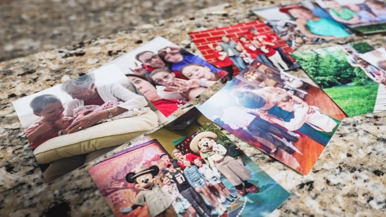 Family photos are displayed in the Pope family’s kitchen.