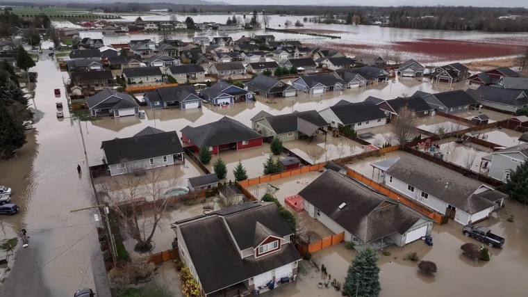 aerial view of rows of houses in high flood waters