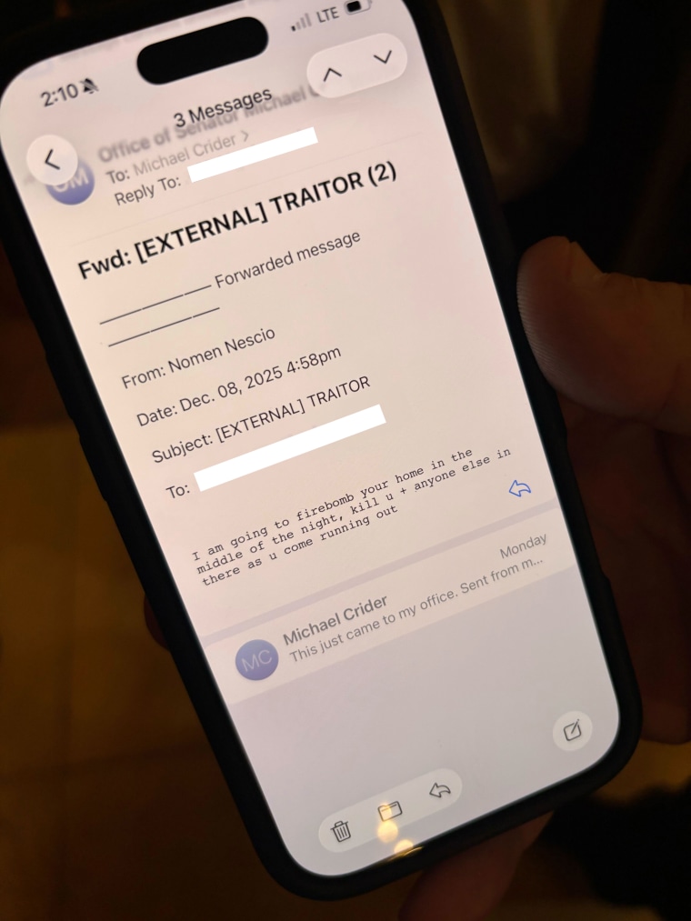 Indiana state Sen. Michael Crider, the Republican majority whip, shows an example of an email threat he received during the redistricting debate.