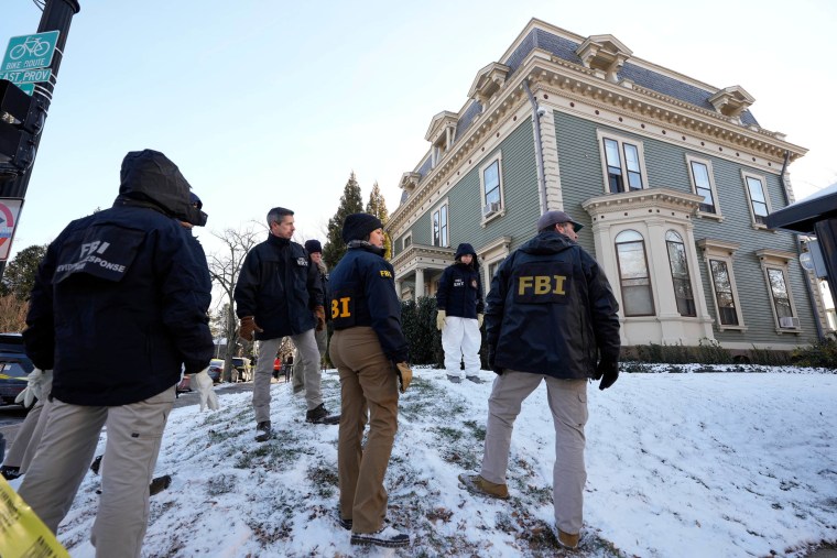 Members of the FBI search for evidence near the campus of Brown University, Monday, Dec. 15, 2025, in Providence, R.I.