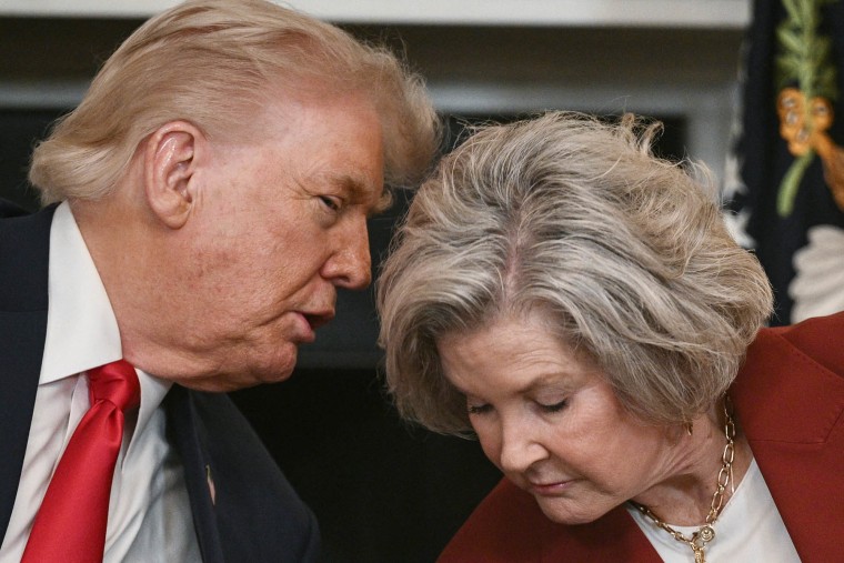 President Donald Trump speaks with White House Chief of Staff Susie Wiles during an "Invest America" roundtable discussion in the State Dining Room of the White House in Washington, DC on June 9, 2025.