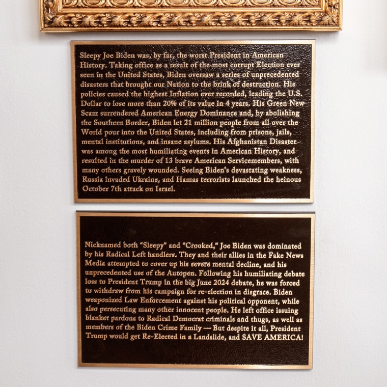 Text on two plaques that read: "Sleepy Joe Biden was, by far, the worst President in American History. Taking office as a result of the most corrupt Election ever seen in the United States, Biden oversaw a series of unprecedented disasters that brought our Nation to the brink of destruction. His policies caused the highest Inflation ever recorded, leading the U.s. Dollar to lose more than 20% of its value in 4 years. His Green New Scam surrendered American Energy Dominance and, by abolishing the Southern Border, Biden let 21 million people from all over the World pour into the United States, including from prisons, jails, mental institutions, and insane asylums. His Afghanistan Disaster was among the most humiliating events in American History, and resulted in the murder of 13 brave American Servicemembers, with many others gravely wounded. Seeing Biden's devastating weakness, Russia invaded Ukraine, and Hamas terrorists launched the heinous October 7th attack on Israel. Nicknamed both "Sleepy" and "Crooked," Joe Biden was dominated by his Radical Left handlers. They and their allies in the Fake News Media attempted to cover up his severe mental decline, and his unprecedented use of the Autopen. Following his humiliating debate loss to President Trump in the big Jume 2024 debate, he was forced to withdraw from his campaign for re-election in disgrace. Biden weaponized Law Enforcement against his political opponent, while also persecuting many other innocent people. He left office issuing blanket pardons to Radical Democrat criminals and thugs, as well as members of the Biden Crime Family - But despite it all, President Trump would get Re-Elected in a Landslide, and SAVE AMERICA!"
