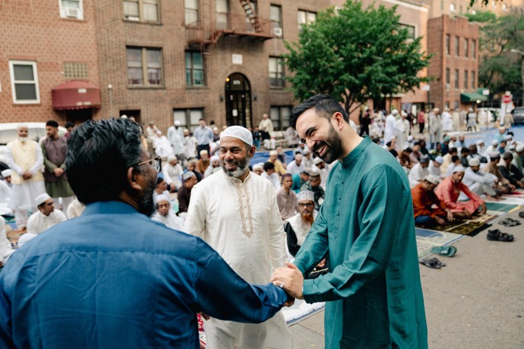 Assemblyman Zohran Mamdani greets a supporter ahead of an Eid service and prayer at the Parkchester Islamic Center