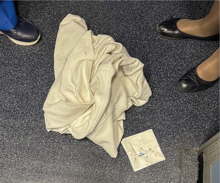 A jacket and napkin covered in the suspected bed bugs from the KLM flight. 