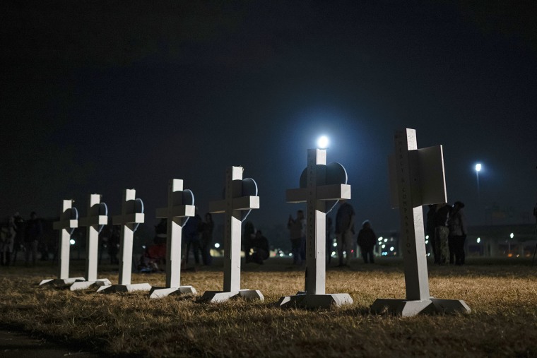 Crosses stand during a vigil on Nov. 7, 2025, for those killed and missing after a UPS plane crashed in Louisville, Ky. 