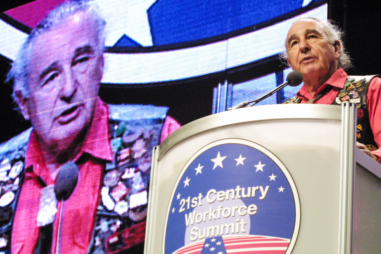 Ben Nighthorse Campbell speaks at a podium on stage