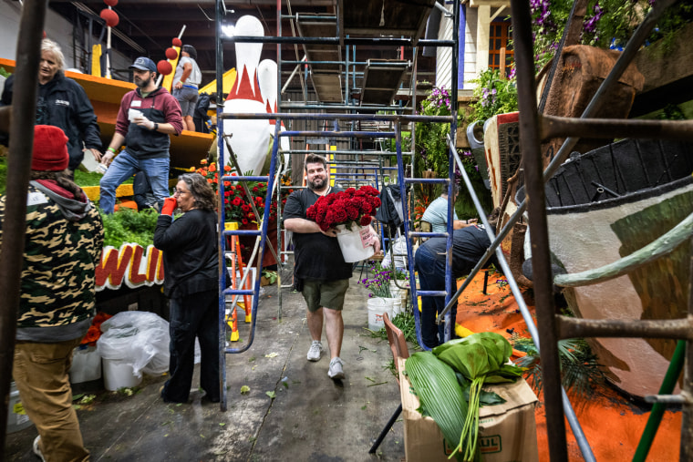 Volunteers construct the 'Go Bowling" float