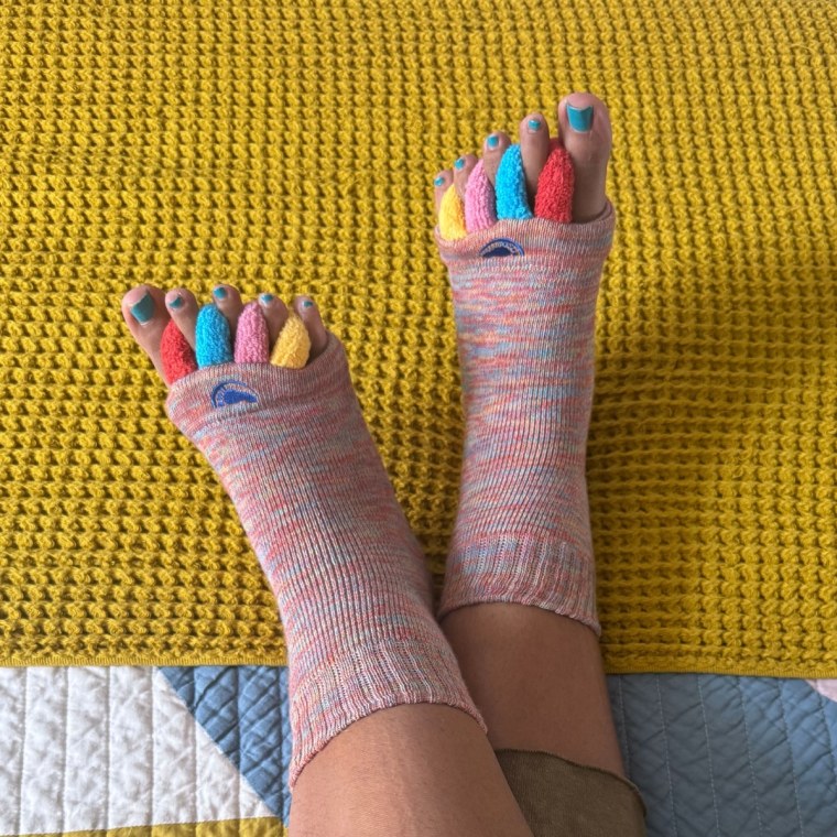 Woman wearing colorful foot alignment socks