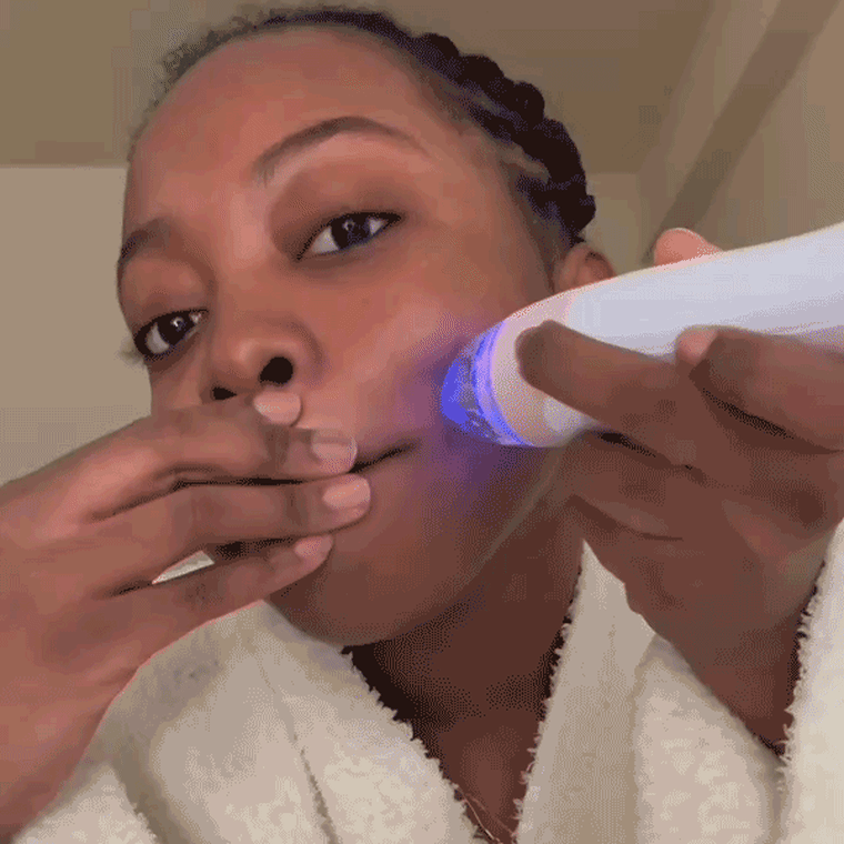 GIF of woman using a PMD skin care device to exfoliate her skin