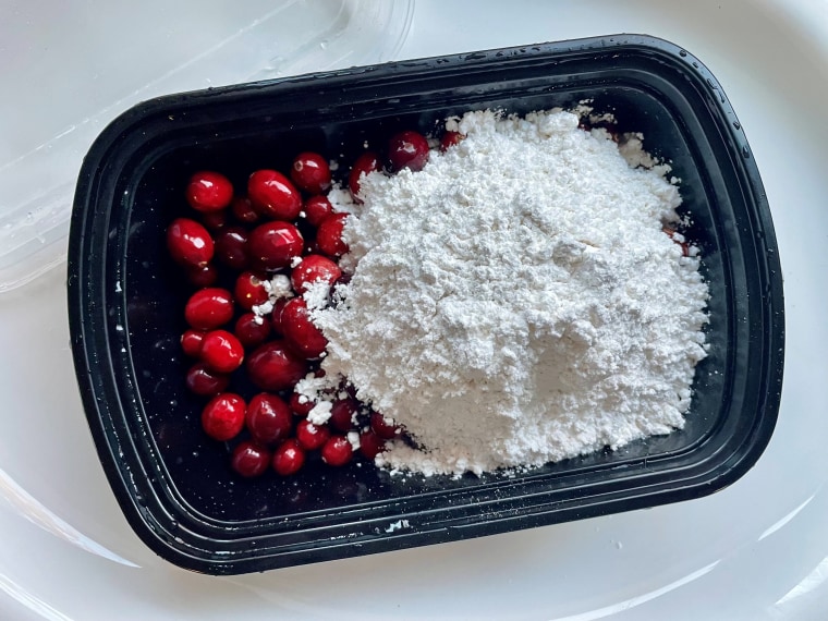 I added about 2 cups of powdered sugar for a bag of cranberries. It was too much, which is just enough.
