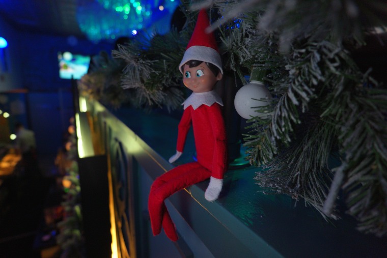 An elf spies something nice at the Cheers from the Shelf pop-up bar in Washington, D.C.