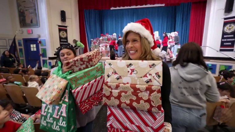 Hoda hands out gifts.