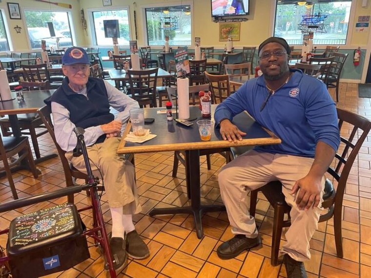 Charlie Hicks and Donell Stallworth sit at a table in Shrimp Basket in Pensacola Florida on Dec. 18.