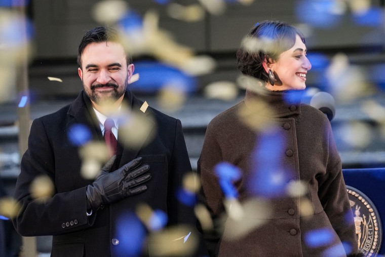 New York Mayor Zohran Mamdani and his wife Rama Duwaji smile as confetti falls after his ceremonial inauguration as mayor at City Hall Thursday January 1, 2026 in New York.