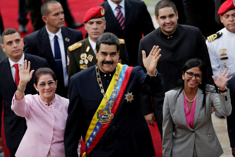 VenezVenezuela's President Nicolas Maduro, his wife Cilia Flores, left, and then-National Constituent Assembly President Delcy Rodriguez
