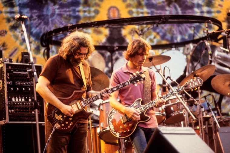Jerry Garcia, left, and Bob Weir play guitar on stage