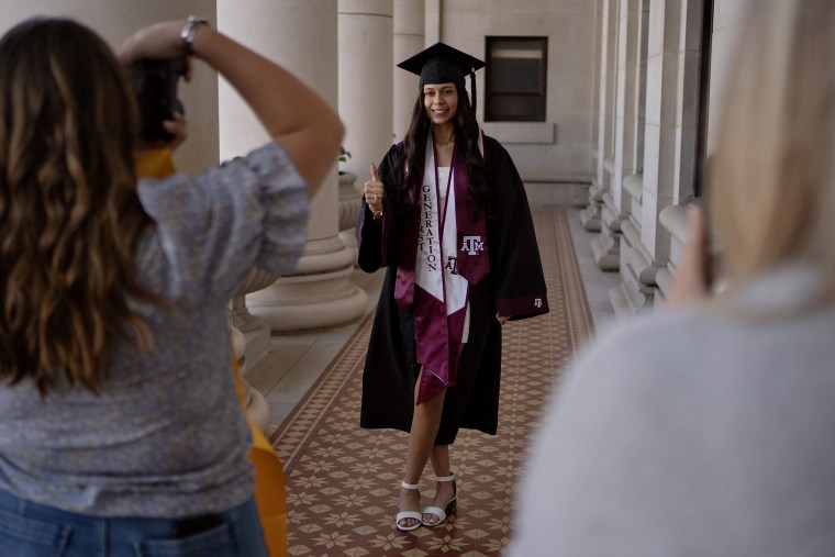 Guerrero poses for a photo in her cap and gown while wearing the new prosthesis.