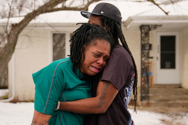 Teyana Gibson Brown, left, wife of Garrison Gibson, is comforted after federal immigration officers arrested Garrison Gibson, Sunday, Jan. 11, 2026, in Minneapolis. 