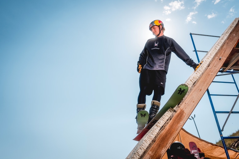 Freestyle skier Mac Forehand starts his run down a jump equipped with an airbag landing