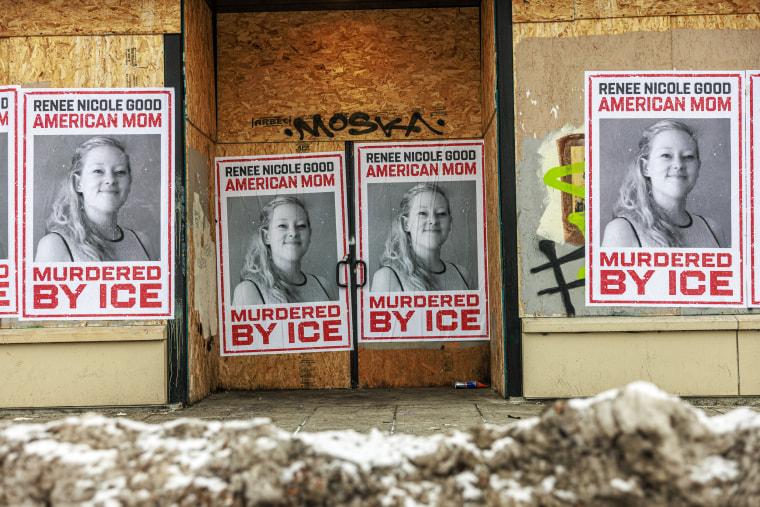Boarded up businesses with posters reading "Renee Nicole Good murdered by ICE"