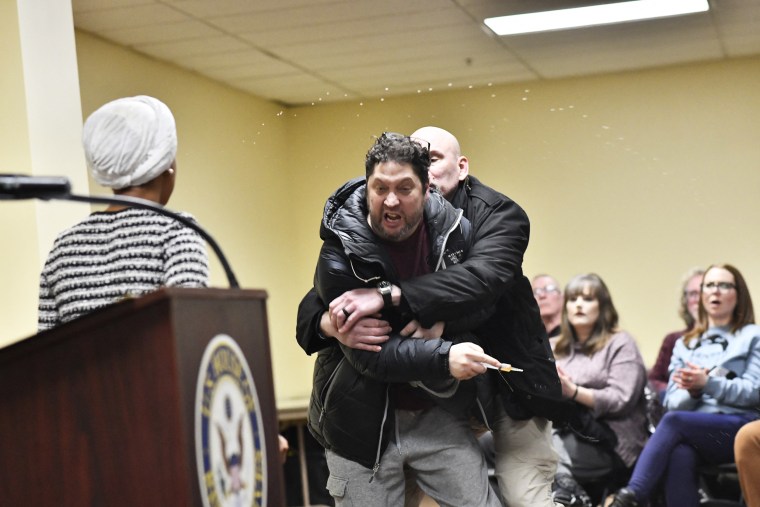 A man is tackled after spraying an unknown substance at US Representative Ilhan Omar