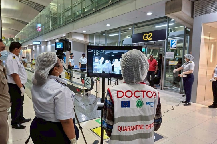 Quarantine doctors watch thermal scanning at the Suvarnabhumi International Airport in Samut Prakarn, Thailand.