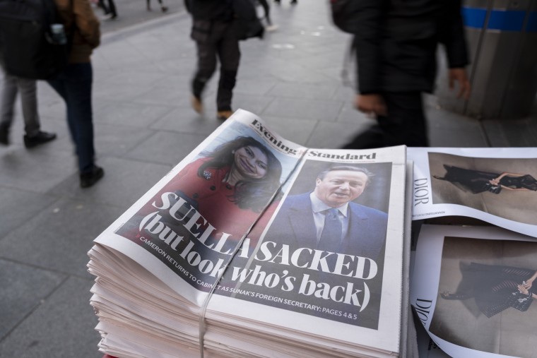 Evening Standard newspaper headline poster reports that Conservative MP and Home Secretary Suella Braverman was sacked from her post, while former PM David Cameron is to return as Foreign Secretary