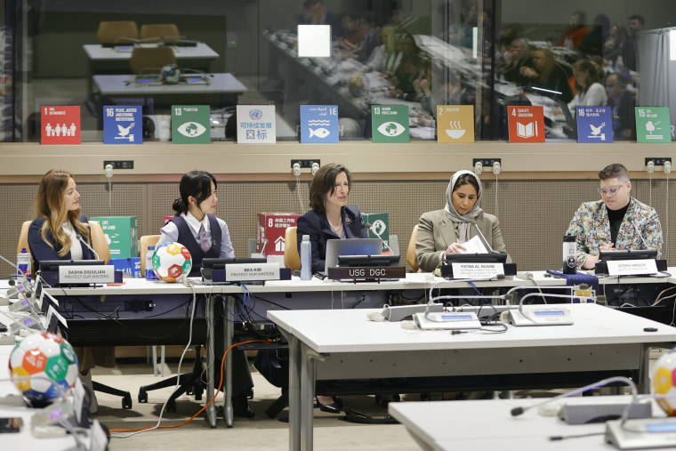Sustainable Development Goals panel; L- R: Sasha Digiulian, Bea Kim, Melissa Fleming, Fatma Nuaimi, Steph Hirsch, sitting in a conference room.