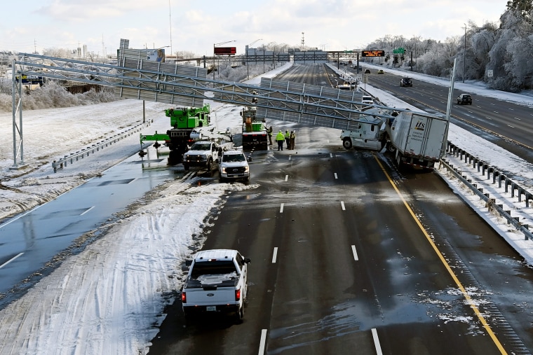 A tractor-trailer northbound on Interstate 65 lost control around near the Interstate 440 split on the icy roadway Monday, Jan. 26, 2026 in Nashville, Tenn.