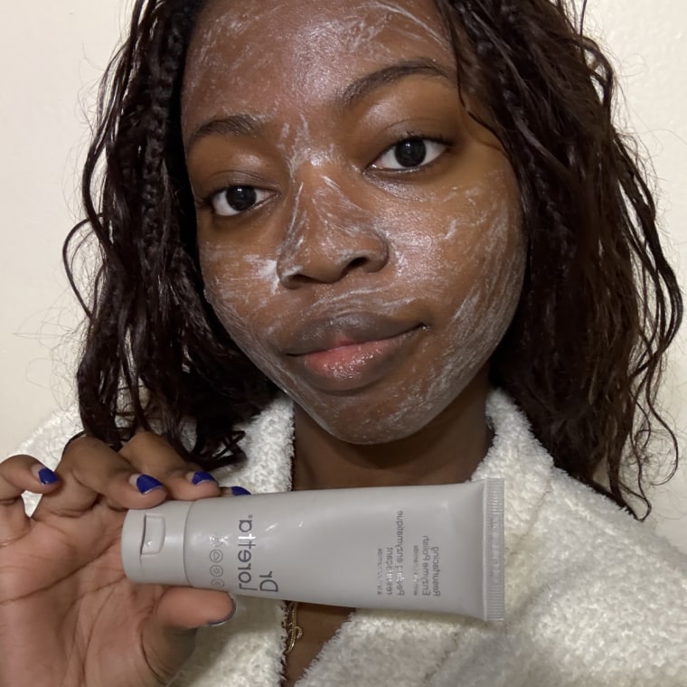 Woman with exfoliating mask on face