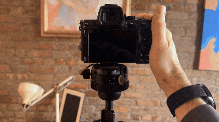 A video clip of someone using the Peak Design Pro Tripod, tilting a camera vertically, panning it up, down, left and right.