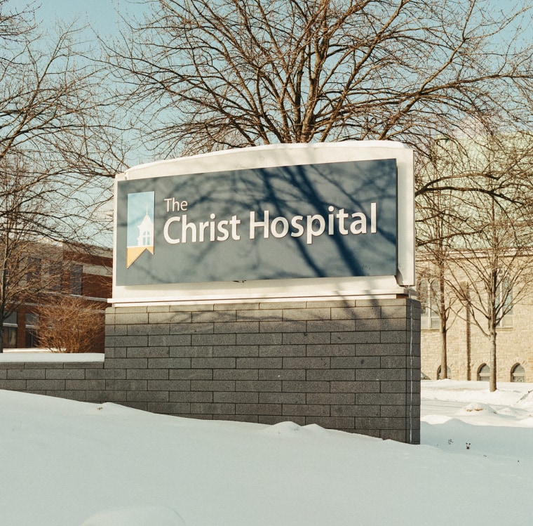 A sign for The Christ Hospital outside in the snow