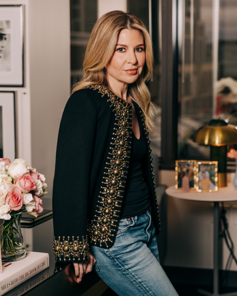 Leigh Anne Clark stands in an office