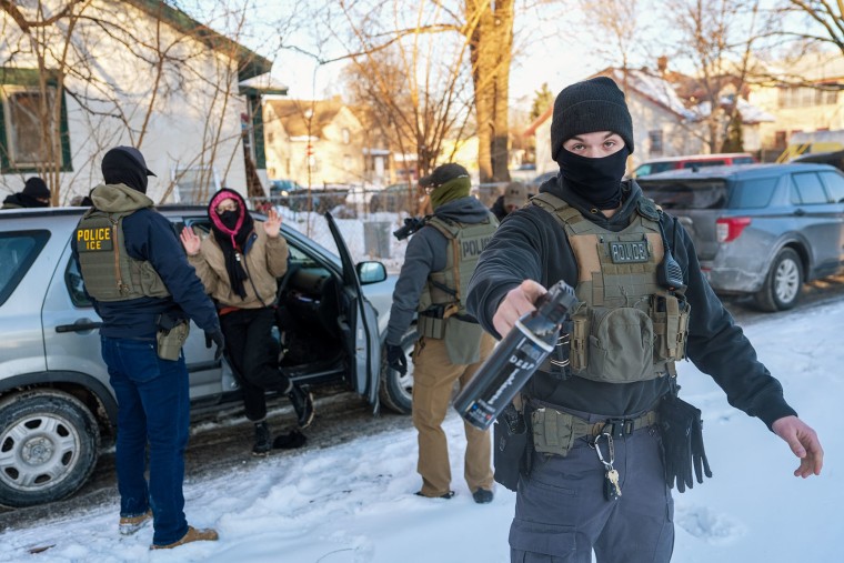 Activists are approached by federal agents for following agent vehicles on Tuesday, Feb. 3, 2026, in Minneapolis.