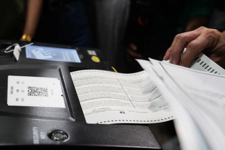 Voters fill out their ballots at a polling place on Election Day in San Juan, Puerto Rico.