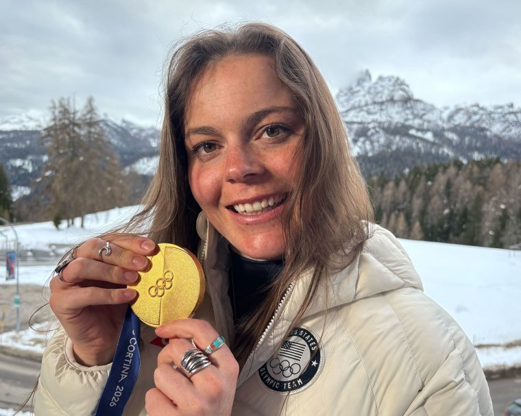 Breezy Johnson poses with her gold medal.