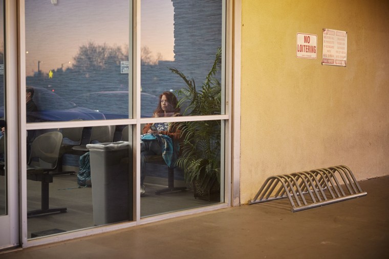 Jill Chamberlain waits to donate plasma before going to her job doing administrative work for a local school district. 