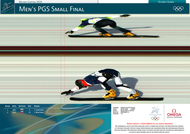 A split-second frame from the finish line in the men's parallel giant slalom snowboard finals between Tervel Zamfirov of Bulgaria and Tim Mastnak of Slovenia in Milan. 