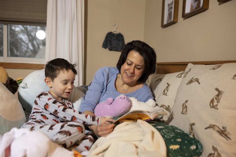 Michelle Eagan reads to her son.